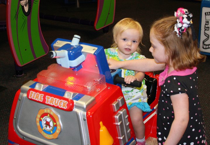 Kylee rides the fire truck